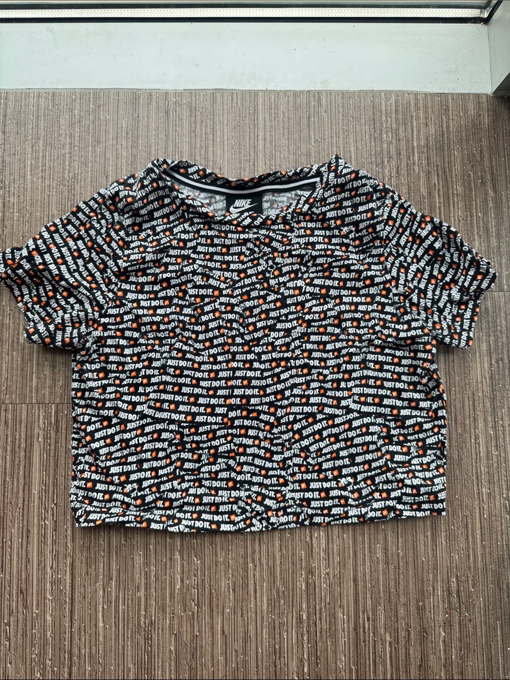 Nike Black Crop Tee with Repeating 'Just Do It' Print